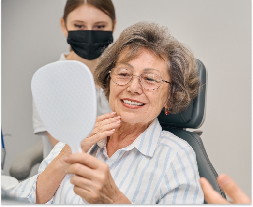 New patient smiling after oral surgery consultation in Metro Detroit